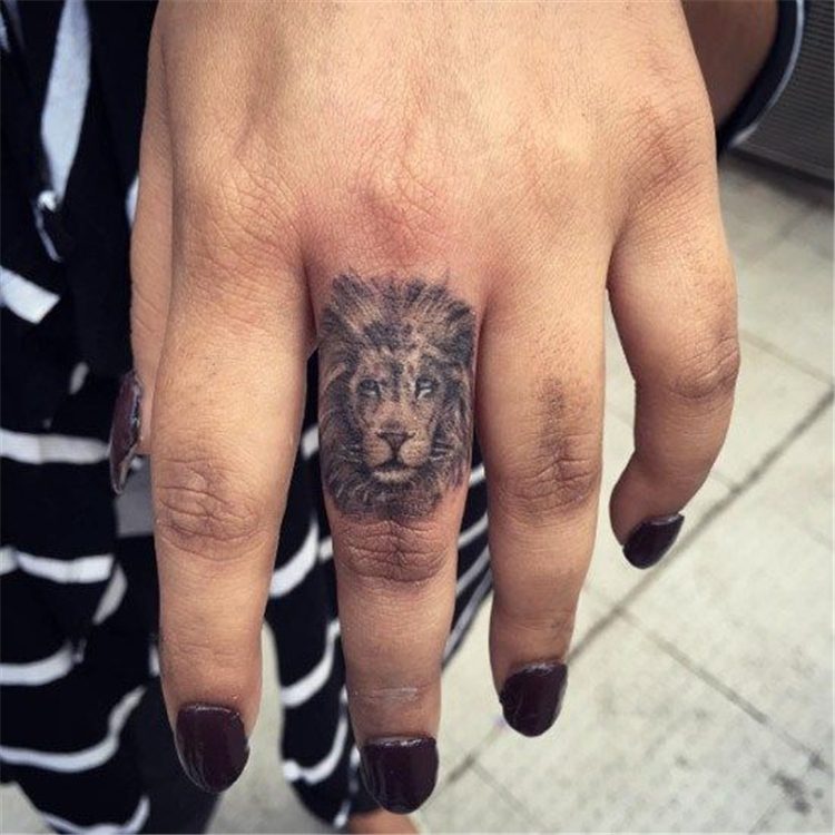 lion finger tattoo for female, finger tattoo ideas for females 