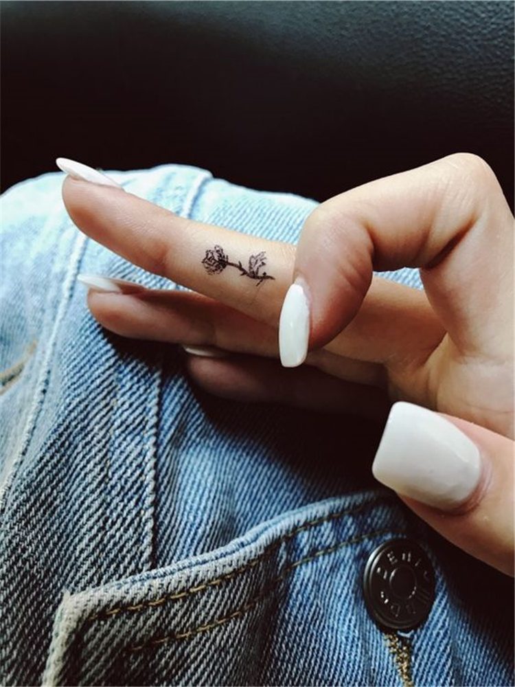 flower tattoo om finger for female, finger tattoo ideas for females 