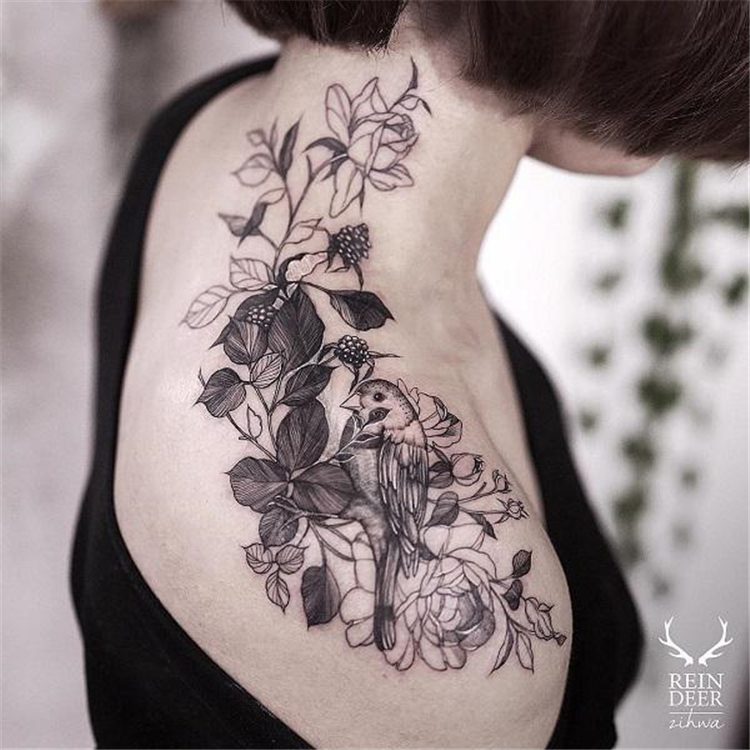rose and bird tattoo on shoulder female