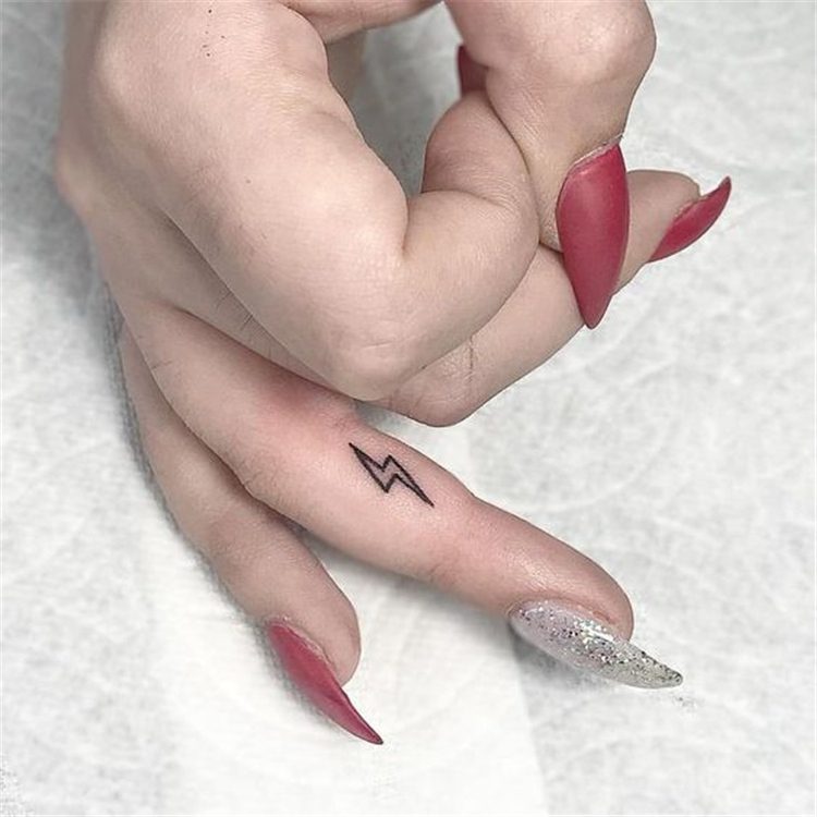 finger thunder tattoo for female, finger tattoo ideas for females 
