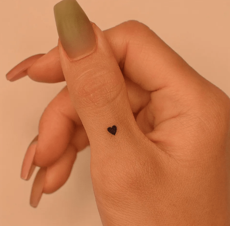 little heart finger tattoo for female, finger tattoo ideas for females