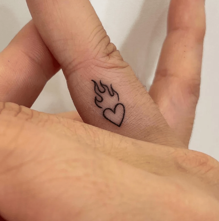 flamming heart tattoo on finger for female, finger tattoo ideas for females
