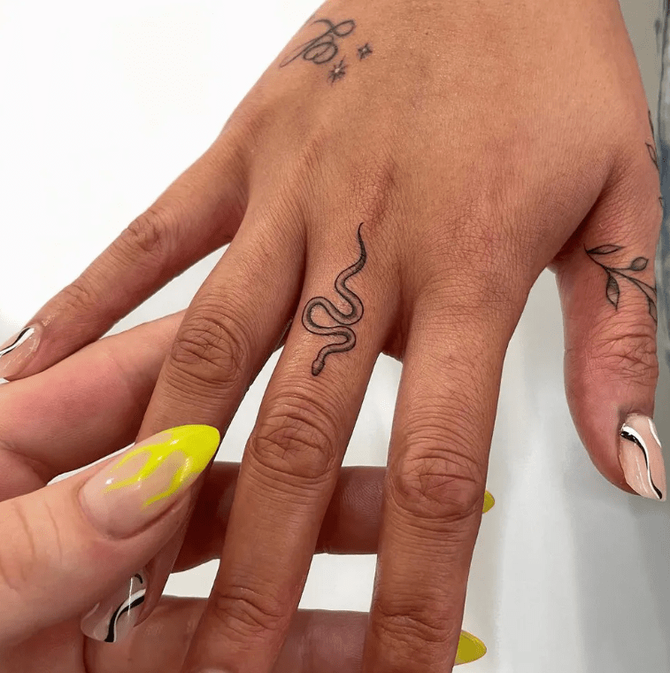 finger snake tattoo for female, finger tattoo ideas for females