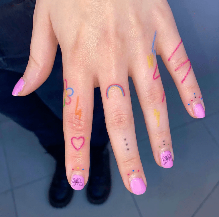 Funky Rainbow on finger for female, finger tattoo ideas for females