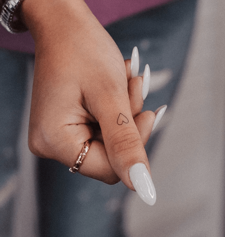 little heart tattoo on finger for female, finger tattoo ideas for females 
