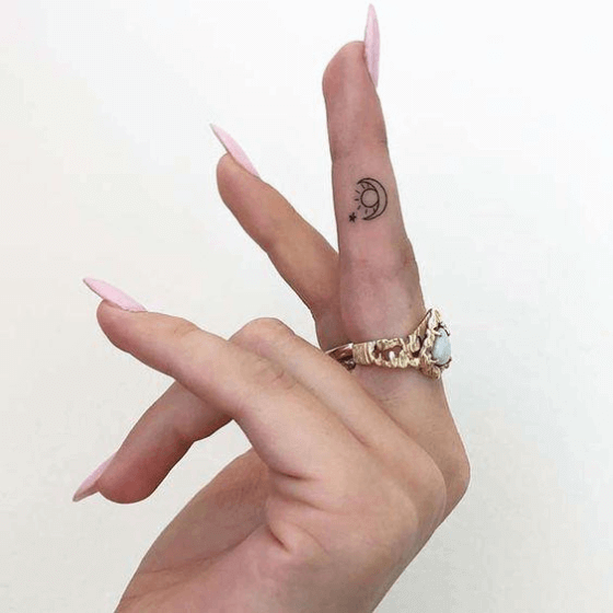 finger sun and moon tattoo designs
